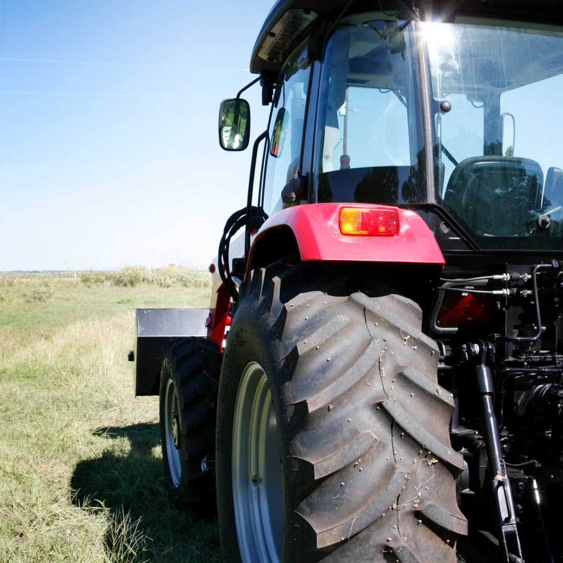 Agricultural Tyre in the field on a tractor rear view 2